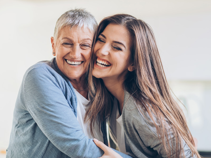 two ladies smiling