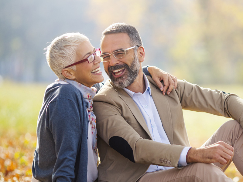 elderly couple smiling